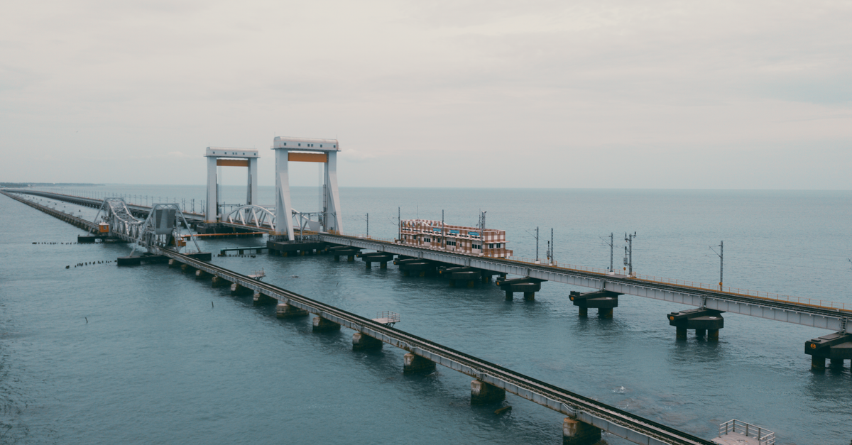 Aerial shot of the historical Pamban Bridge connecting Rameswaram with mainland India.